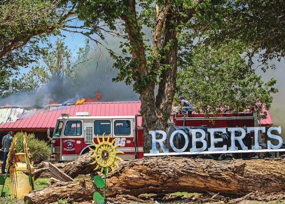 Firefighters work to extenguish the blaze that destroyed the residence of Harold Roberts on June 11, 2022/