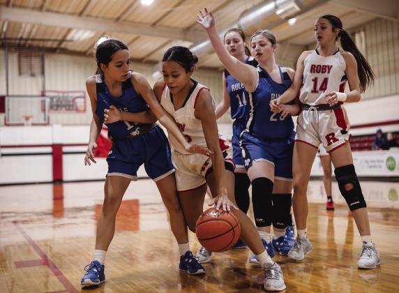 Roby Junior Joselynn Williams fights through Bobcat defenders during the Lady Lions 49-5 win over Rule. The Lady Lions next matchup will be against Knox City this Friday at 6pm. PHOTO BY TRICIA HURt