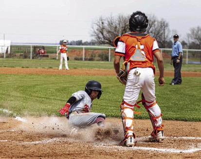 Right: Roby's Keegan Encizo slides into home plate to score the game winning run against Rotan to defeat the Hammers 4-3 this past Saturday in Roby. The Lions and Hammers battled in back to back games Saturday and Tuesday-Wednesday. The Lions finished the two game series with a drag-out 22-20 win over the Hammers in Rotan. PHOTO BY MARK MARTINEZ