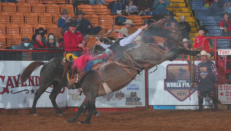TW Flowers, riding, Duckworth, during the first day of Junior Roughstock World Finals at the Junior World Finals. Photo By: Bull Stock Media