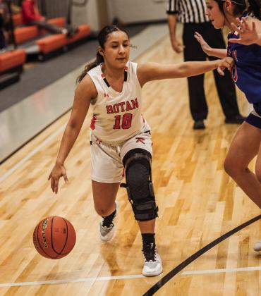 Rotan Junior Shyanne Gaspar looks for a driving lane during the Lady Hammers 63-22 win over Knox City. PHOTO BY MARK MARTINEZ