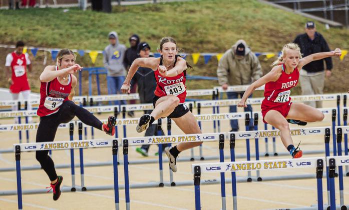 Aspermont's Mylee Van Meter (left), Rotan's Becca Kincheloe (middle), and Roby's Brylie Duniven (right) battle in the Girls 100 Meter Hurdle finals. Duniven would claim the Bronze in the event. PHOTO BY MARK MARTINEZ