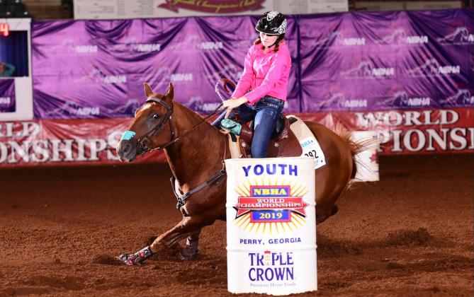 Cissa Dixon, daughter of Katrina and Chase Jarvis or Rotan, rounds the last barrel during her run last year at the NBHA World Championship in Perry, Georgia (Courtesy Photo)